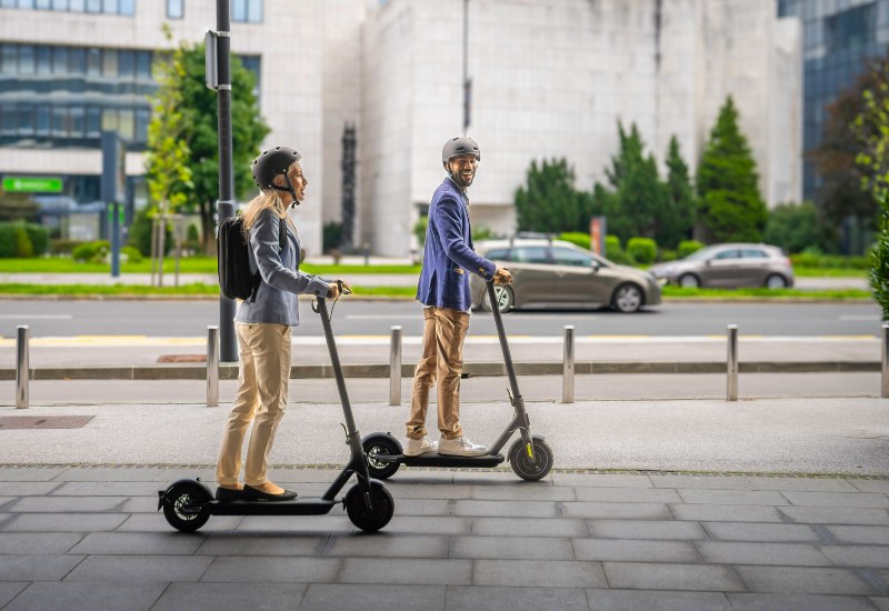 Two individuals on e-scooters showcase how to avoid DWI of e-scooters in Long Island & Nassau County